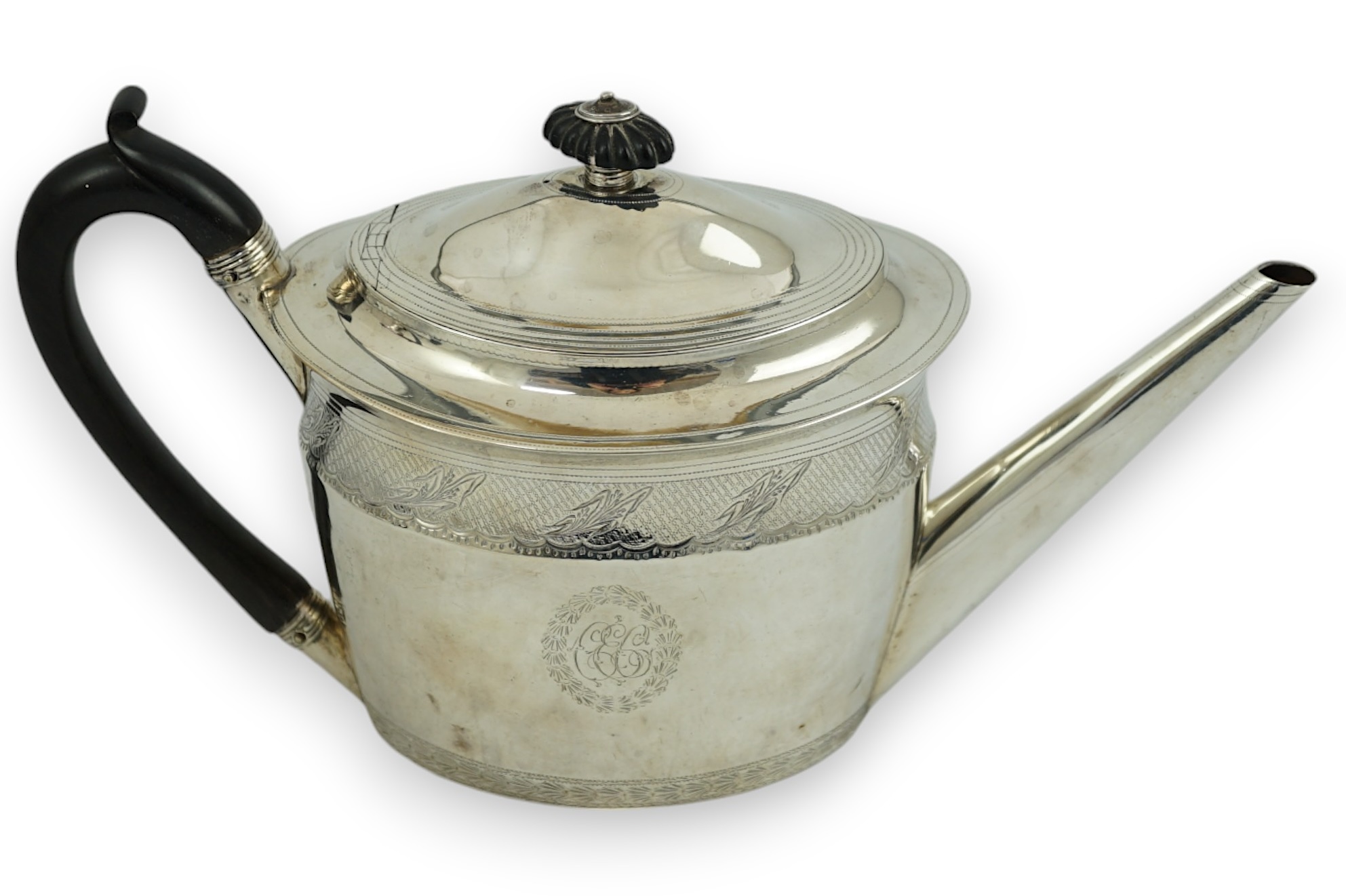 A George III engraved silver oval teapot, Chawner & Emes, London, 1797, gross weight 15.5oz.